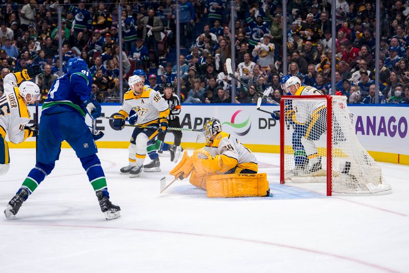 Apr 21, 2024; Vancouver, British Columbia, CAN; Vancouver Canucks forward Dakota Joshua (81) scores the game winning goal on Nashville Predators goalie Juuse Saros (74) in the third period in game one of the first round of the 2024 Stanley Cup Playoffs at Rogers Arena. Mandatory Credit: Bob Frid-USA TODAY Sports