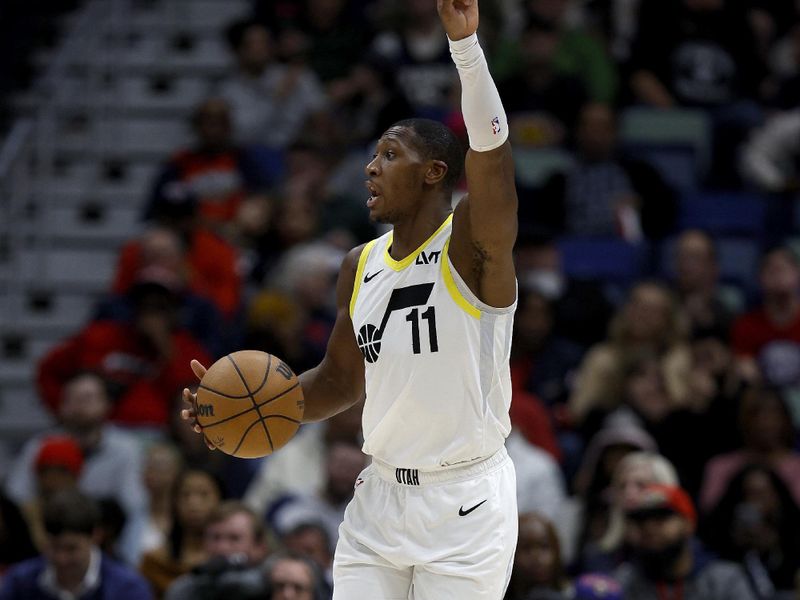 NEW ORLEANS, LOUISIANA - JANUARY 23: Kris Dunn #11 of the Utah Jazz dribbles the ball down court during the second quarter of an NBA game against the New Orleans Pelicans at Smoothie King Center on January 23, 2024 in New Orleans, Louisiana. NOTE TO USER: User expressly acknowledges and agrees that, by downloading and or using this photograph, User is consenting to the terms and conditions of the Getty Images License Agreement. (Photo by Sean Gardner/Getty Images)