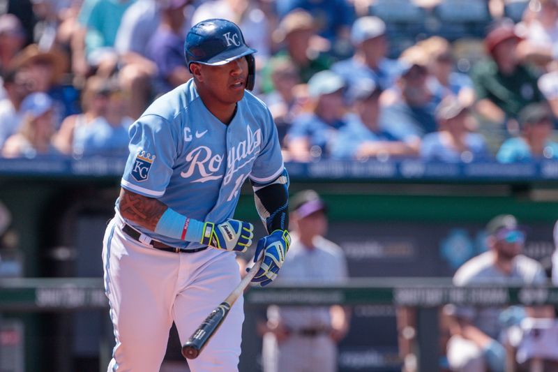 Jun 3, 2023; Kansas City, Missouri, USA;  Kansas City Royals catcher Salvador Perez (13) watches the ball after a hit during the first inning against the Colorado Rockies at Kauffman Stadium. Mandatory Credit: William Purnell-USA TODAY Sports