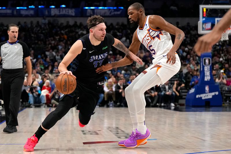 DALLAS, TEXAS - JANUARY 24: Luka Doncic #77 of the Dallas Mavericks controls the ball as Kevin Durant #35 of the Phoenix Suns defends during the second half at American Airlines Center on January 24, 2024 in Dallas, Texas. NOTE TO USER: User expressly acknowledges and agrees that, by downloading and or using this photograph, User is consenting to the terms and conditions of the Getty Images License Agreement. (Photo by Sam Hodde/Getty Images)