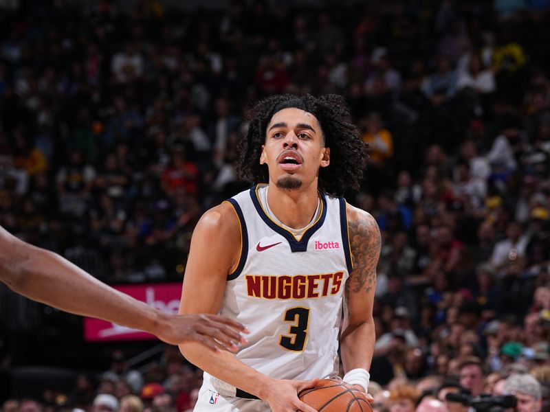 DENVER, CO - OCTOBER 13: Julian Strawther #3 of the Denver Nuggets handles the ball during the game against the Phoenix Suns on October 13, 2024 at Ball Arena in Denver, Colorado. NOTE TO USER: User expressly acknowledges and agrees that, by downloading and/or using this Photograph, user is consenting to the terms and conditions of the Getty Images License Agreement. Mandatory Copyright Notice: Copyright 2024 NBAE (Photo by Garrett Ellwood/NBAE via Getty Images)