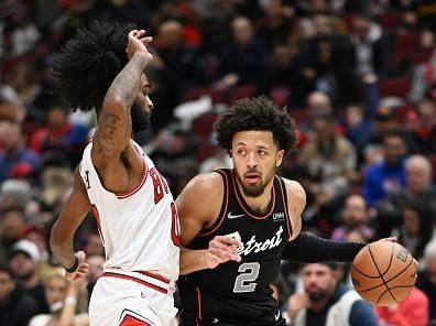 CHICAGO, ILLINOIS - NOVEMBER 12: Cade Cunningham #2 of the Detroit Pistons drives with the basketball in the second half against Coby White #0 of the Chicago Bulls at the United Center on November 12, 2023 in Chicago, Illinois.  NOTE TO USER: User expressly acknowledges and agrees that, by downloading and or using this photograph, User is consenting to the terms and conditions of the Getty Images License Agreement.  (Photo by Quinn Harris/Getty Images)