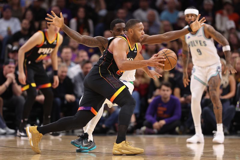 PHOENIX, ARIZONA - NOVEMBER 15: Eric Gordon #23 of the Phoenix Suns drives the ball past Shake Milton #18 of the Minnesota Timberwolves during the first half of the NBA game at Footprint Center on November 15, 2023 in Phoenix, Arizona. The Suns defeated the Timberwolves 133-115.  NOTE TO USER: User expressly acknowledges and agrees that, by downloading and or using this photograph, User is consenting to the terms and conditions of the Getty Images License Agreement.  (Photo by Christian Petersen/Getty Images)