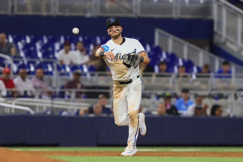 Aug 19, 2024; Miami, Florida, USA; Miami Marlins third baseman Connor Norby (24) throws to first base to retire Arizona Diamondbacks third baseman Eugenio Suarez (not pictured) during the seventh inning at loanDepot Park. Mandatory Credit: Sam Navarro-USA TODAY Sports