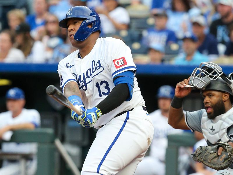 Jul 20, 2024; Kansas City, Missouri, USA; Kansas City Royals catcher Salvador Perez (13) watches his base hit against the Chicago White Sox during the seventh inning at Kauffman Stadium. Mandatory Credit: Scott Sewell-USA TODAY Sports