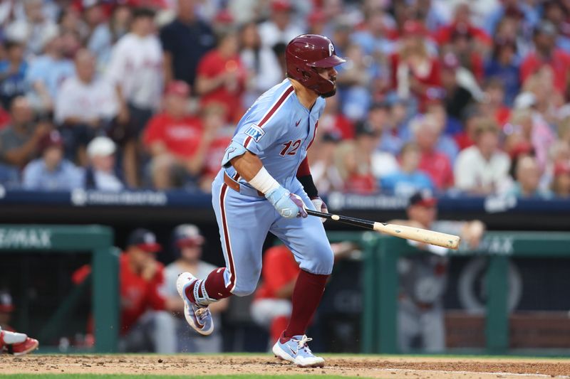 Aug 15, 2024; Philadelphia, Pennsylvania, USA; Philadelphia Phillies designated hitter Kyle Schwarber (12) hits a single during the fourth inning against the Washington Nationals at Citizens Bank Park. Mandatory Credit: Bill Streicher-USA TODAY Sports