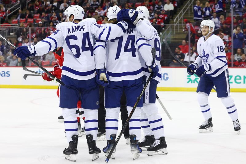 Oct 10, 2024; Newark, New Jersey, USA; Toronto Maple Leafs center Bobby McMann (74) celebrates his goal with teammates against the New Jersey Devils during the first period at Prudential Center. Mandatory Credit: Ed Mulholland-Imagn Images