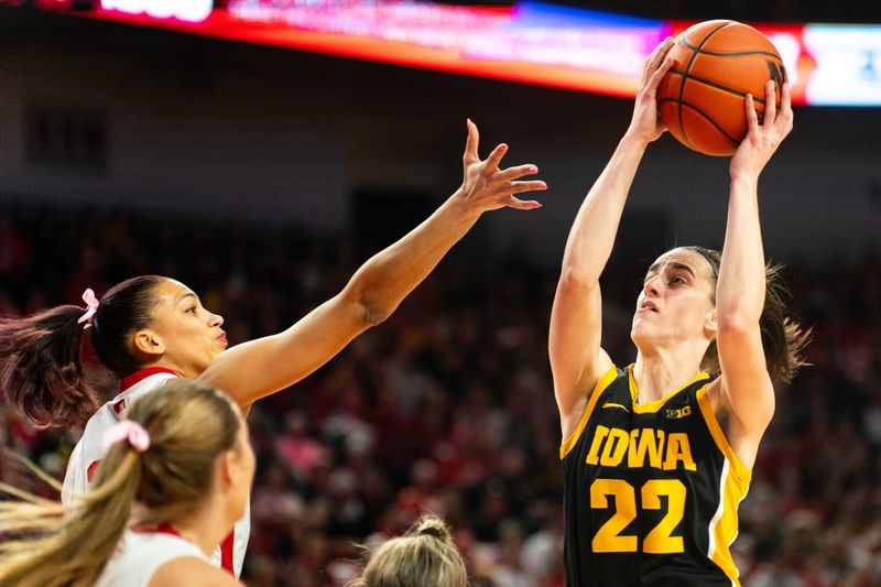 Feb 11, 2024; Lincoln, Nebraska, USA; Iowa Hawkeyes guard Caitlin Clark (22) gets a rebound against the Nebraska Cornhuskers during the first quarter at Pinnacle Bank Arena. Mandatory Credit: Dylan Widger-USA TODAY Sports