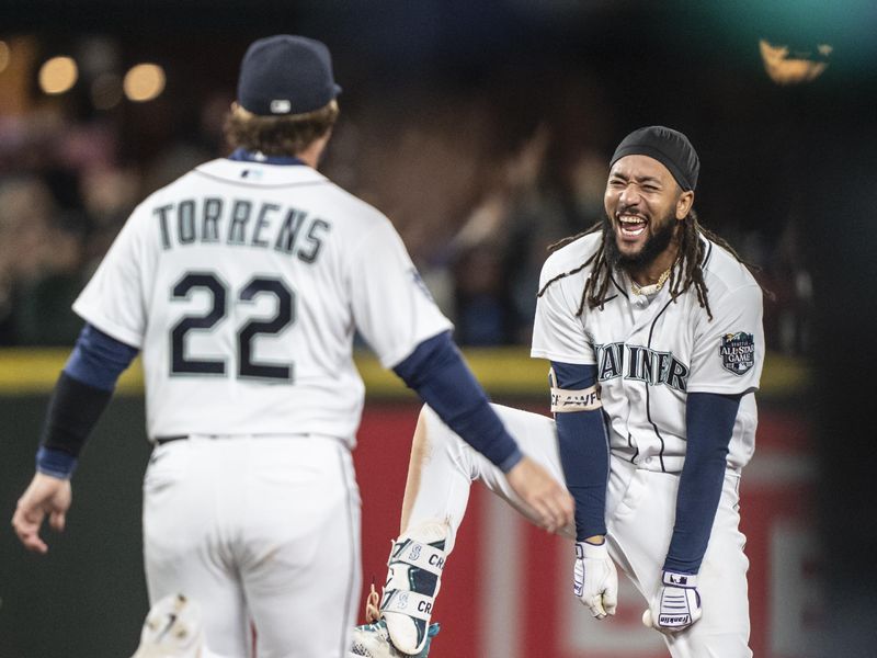 Sep 28, 2023; Seattle, Washington, USA; Seattle Mariners shortstop J.P. Crawford (3) and catcher Luis Torrens (22) after a game against the Texas Rangers at T-Mobile Park. Mandatory Credit: Stephen Brashear-USA TODAY Sports