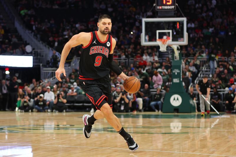 MILWAUKEE, WISCONSIN - NOVEMBER 13: Nikola Vucevic #9 of the Chicago Bulls handles the ball during a game against the Milwaukee Bucks at Fiserv Forum on November 13, 2023 in Milwaukee, Wisconsin. NOTE TO USER: User expressly acknowledges and agrees that, by downloading and or using this photograph, User is consenting to the terms and conditions of the Getty Images License Agreement. (Photo by Stacy Revere/Getty Images)