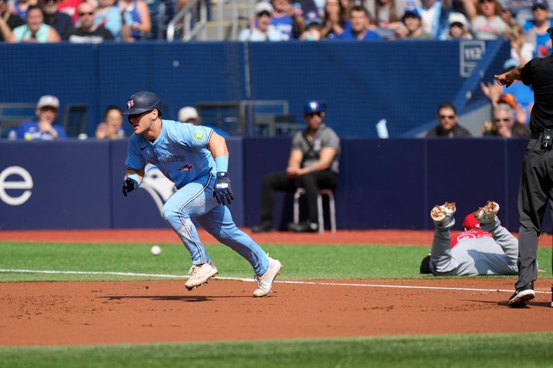 Aug 24, 2024; Toronto, Ontario, CAN; Toronto Blue Jays center fielder Daulton Varsho (25) heads for second base after a throwing error by Los Angeles Angels starting pitcher Carson Fulmer (not pictured) during the  first inning at Rogers Centre. Mandatory Credit: John E. Sokolowski-USA TODAY Sports