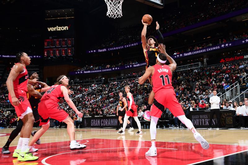 ATLANTA, GA - February 23: Jalen Johnson #1 of the Atlanta Hawks drives to the basket during the game against the Toronto Raptors on February 23, 2024 at State Farm Arena in Atlanta, Georgia.  NOTE TO USER: User expressly acknowledges and agrees that, by downloading and/or using this Photograph, user is consenting to the terms and conditions of the Getty Images License Agreement. Mandatory Copyright Notice: Copyright 2024 NBAE (Photo by Scott Cunningham/NBAE via Getty Images)