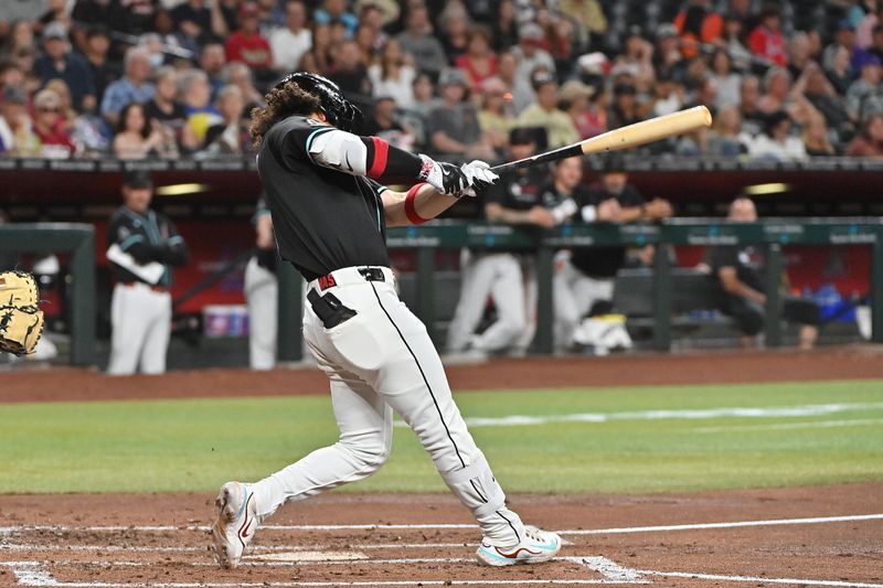 Jun 30, 2025; Phoenix, Arizona, USA;  Arizona Diamondbacks outfielder Alek Thomas (5) doubles in the third inning against the San Francisco Giants at Chase Field. Mandatory Credit: Matt Kartozian-Imagn Images