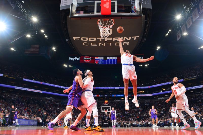 PHOENIX, AZ - NOVEMBER 20: Jericho Sims #20 of the New York Knicks rebounds the ball during the game against the Phoenix Suns on November 20, 2024 at Footprint Center in Phoenix, Arizona. NOTE TO USER: User expressly acknowledges and agrees that, by downloading and or using this photograph, user is consenting to the terms and conditions of the Getty Images License Agreement. Mandatory Copyright Notice: Copyright 2024 NBAE (Photo by Kate Frese/NBAE via Getty Images)