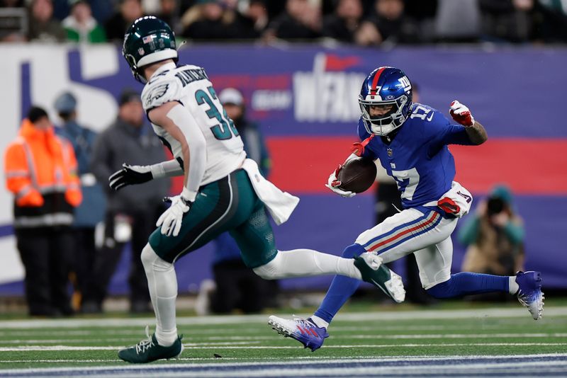 New York Giants wide receiver Wan'Dale Robinson (17) carries the ball against the Philadelphia Eagles during the first quarter of an NFL football game, Sunday, Jan. 7, 2024, in East Rutherford, N.J. (AP Photo/Adam Hunger)