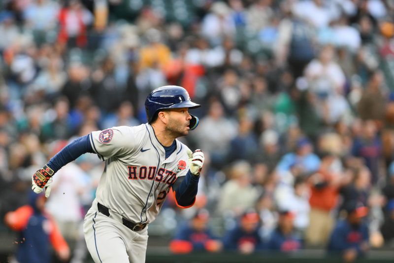 May 27, 2024; Seattle, Washington, USA; Houston Astros second baseman Jose Altuve (27) runs towards first base after hitting a double against the Seattle Mariners during the fifth inning at T-Mobile Park. Mandatory Credit: Steven Bisig-USA TODAY Sports