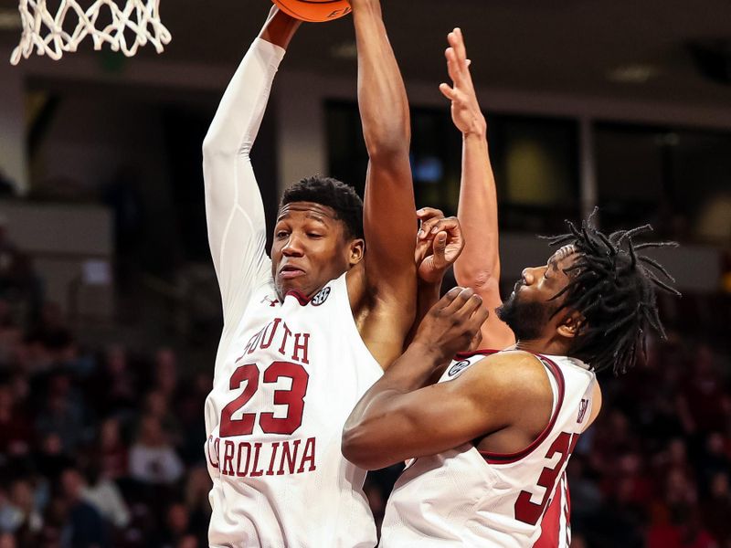 Feb 4, 2023; Columbia, South Carolina, USA; South Carolina Gamecocks forward Gregory Jackson II (23) grabs a rebound next to forward Benjamin Bosmans-Verdonk (31) against the Arkansas Razorbacks in the second half at Colonial Life Arena. Mandatory Credit: Jeff Blake-USA TODAY Sports