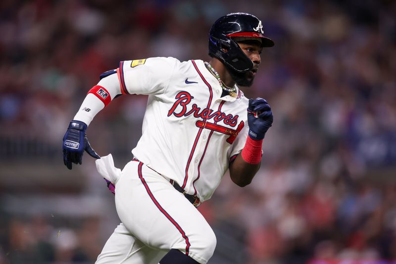 May 8, 2025; Atlanta, Georgia, USA; Atlanta Braves center fielder Michael Harris II (23) hits a single against the Cincinnati Reds in the seventh inning at Truist Park. Mandatory Credit: Brett Davis-Imagn Images
