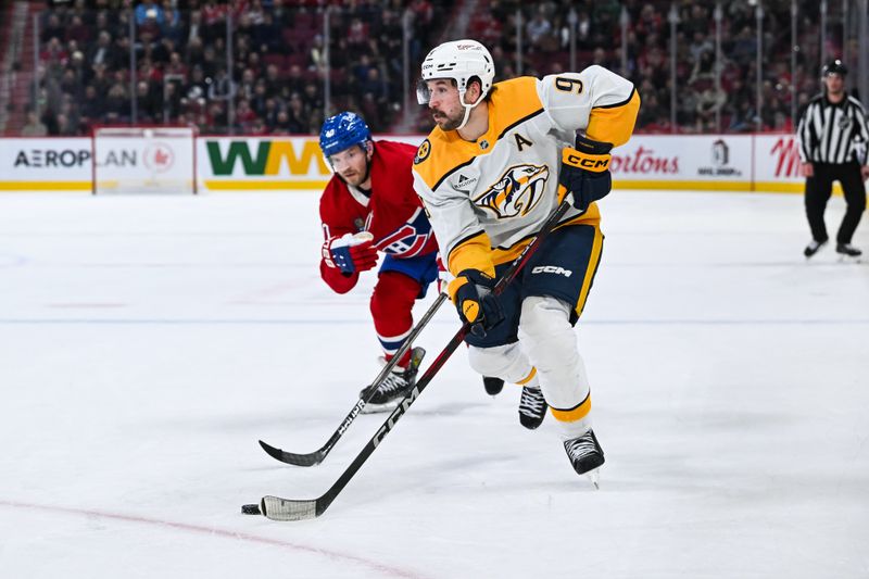 Dec 5, 2024; Montreal, Quebec, CAN; Nashville Predators left wing Filip Forsberg (9) plays the puck against the Nashville Predators during the third period at Bell Centre. Mandatory Credit: David Kirouac-Imagn Images