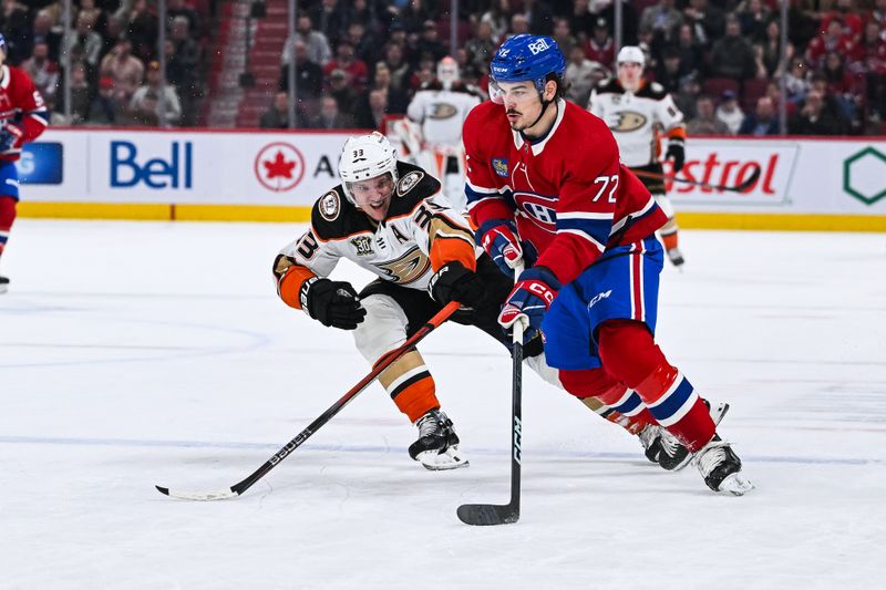 Feb 13, 2024; Montreal, Quebec, CAN; Montreal Canadiens defenseman Arber Xhekaj (72) defends the puck against Anaheim Ducks right wing Jakob Silfverberg (33) during the first period at Bell Centre. Mandatory Credit: David Kirouac-USA TODAY Sports