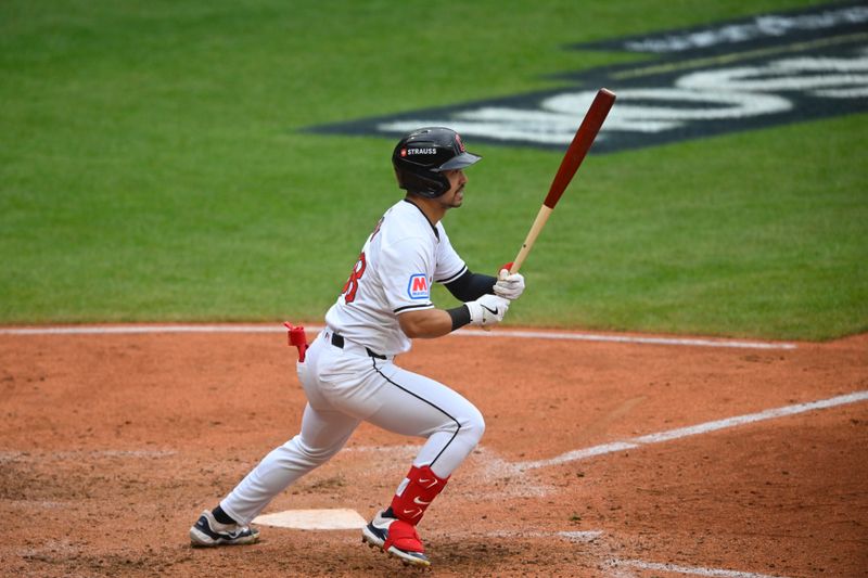 Oct 12, 2024; Cleveland, Ohio, USA; Cleveland Guardians outfielder Steven Kwan (38) hits a single in the seventh inning against the Detroit Tigers during game five of the ALDS for the 2024 MLB Playoffs at Progressive Field. Mandatory Credit: David Richard-Imagn Images