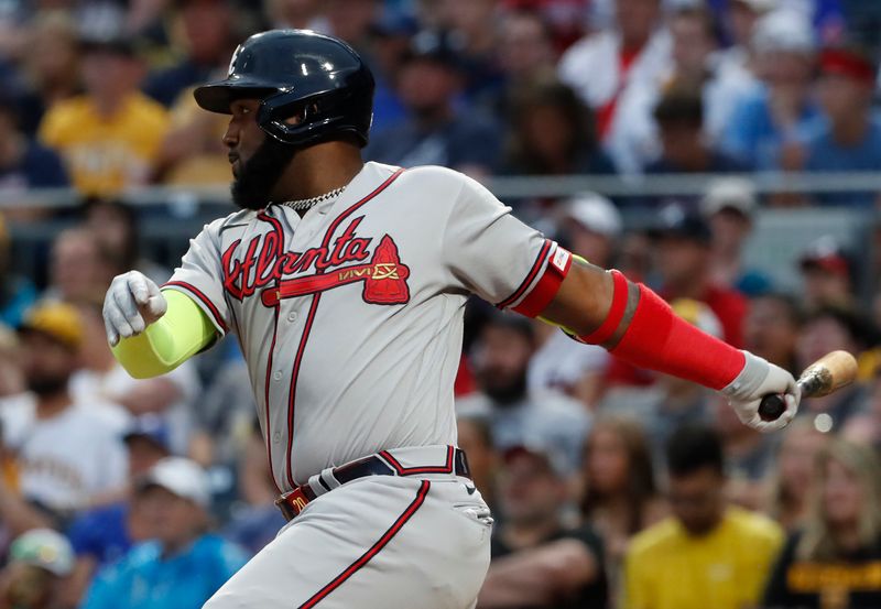 Aug 7, 2023; Pittsburgh, Pennsylvania, USA;  Atlanta Braves designated hitter Marcell Ozuna (20) hits a RBI single against the Pittsburgh Pirates during the fourth inning at PNC Park. Mandatory Credit: Charles LeClaire-USA TODAY Sports