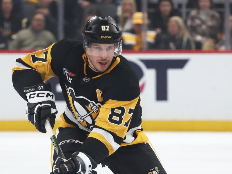 Dec 21, 2025; Pittsburgh, Pennsylvania, USA;  Pittsburgh Penguins center Sidney Crosby (87) skates up ice with the puck against the Montréal Canadiens during the first period at PPG Paints Arena. Mandatory Credit: Charles LeClaire-Imagn Images