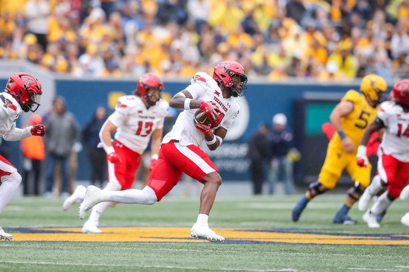 Sep 23, 2023; Morgantown, West Virginia, USA; Texas Tech Red Raiders defensive back Malik Dunlap (24) intercepts a pass during the first quarter against the West Virginia Mountaineers at Mountaineer Field at Milan Puskar Stadium. Mandatory Credit: Ben Queen-USA TODAY Sports