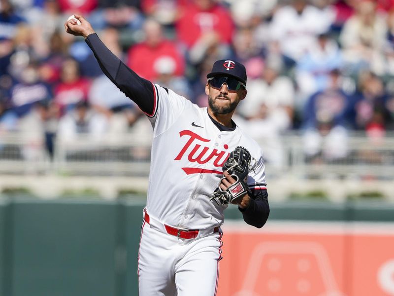 Apr 4, 2024; Minneapolis, Minnesota, USA; Minnesota Twins shortstop Carlos Correa (4) throws to first base for the out during the second inning against the Cleveland Guardians at Target Field. Mandatory Credit: Jordan Johnson-USA TODAY Sports