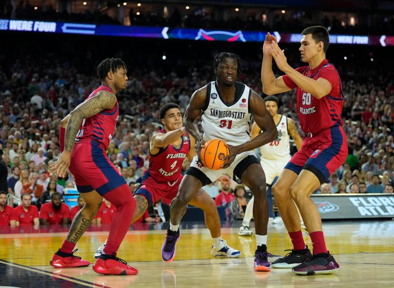 Apr 1, 2023; Houston, TX, USA; San Diego State Aztecs forward Nathan Mensah (31) shoots against Florida Atlantic Owls center Vladislav Goldin (50) in the semifinals of the Final Four of the 2023 NCAA Tournament at NRG Stadium. Mandatory Credit: Robert Deutsch-USA TODAY Sports