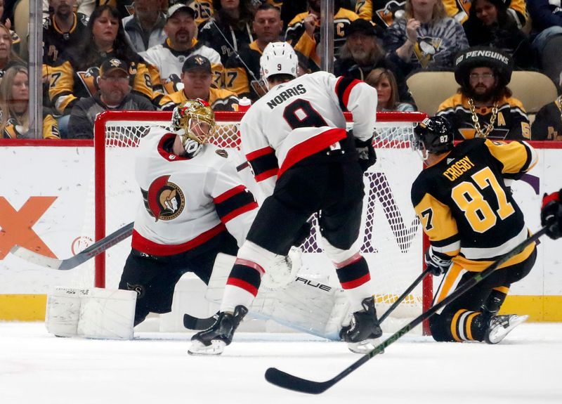 Oct 28, 2023; Pittsburgh, Pennsylvania, USA; Pittsburgh Penguins center Sidney Crosby (87) scores a goal against Ottawa Senators goaltender Joonas Korpisalo (70) during the second period at PPG Paints Arena. Mandatory Credit: Charles LeClaire-USA TODAY Sports