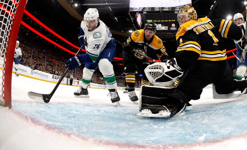 Nov 26, 2024; Boston, Massachusetts, USA; Vancouver Canucks left wing Jake DeBrusk (74) scores on Boston Bruins goaltender Jeremy Swayman (1) during the second period at TD Garden. Mandatory Credit: Winslow Townson-Imagn Images