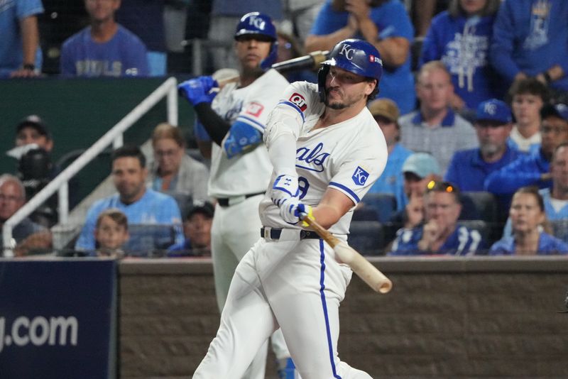 Oct 10, 2024; Kansas City, Missouri, USA; Kansas City Royals first baseman Vinnie Pasquantino (9) hits an RBI double during the sixth inning against the New York Yankees during game four of the ALDS for the 2024 MLB Playoffs at Kauffman Stadium. Mandatory Credit: Denny Medley-Imagn Images