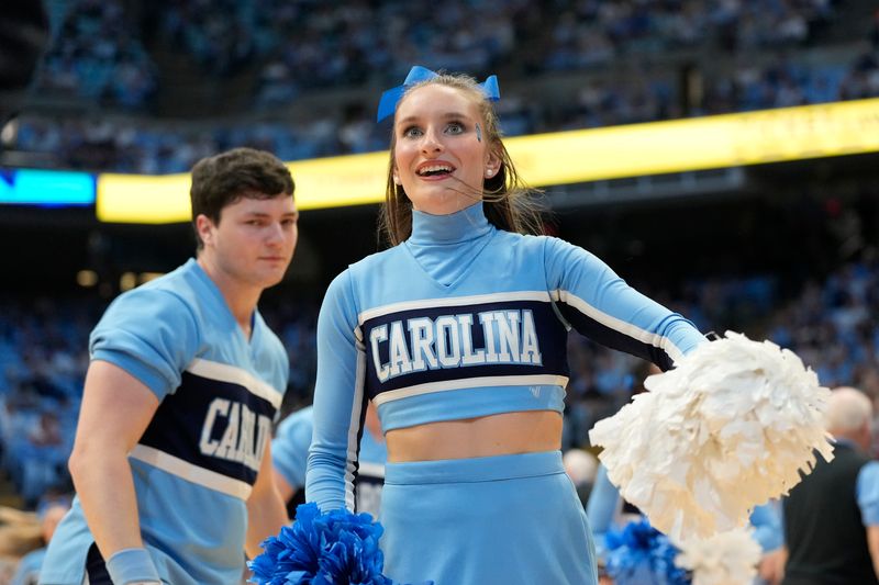 Dec 2, 2023; Chapel Hill, North Carolina, USA;  North Carolina Tar Heels cheerleader performs in the first half at Dean E. Smith Center. Mandatory Credit: Bob Donnan-USA TODAY Sports