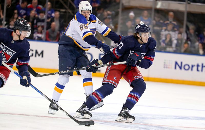 Mar 9, 2024; New York, New York, USA: New York Rangers center Matt Rempe (73) gets shoved by St. Louis Blues left wing Pavel Buchnevich (89) during the first period at Madison Square Garden. Mandatory Credit: Danny Wild-USA TODAY Sports