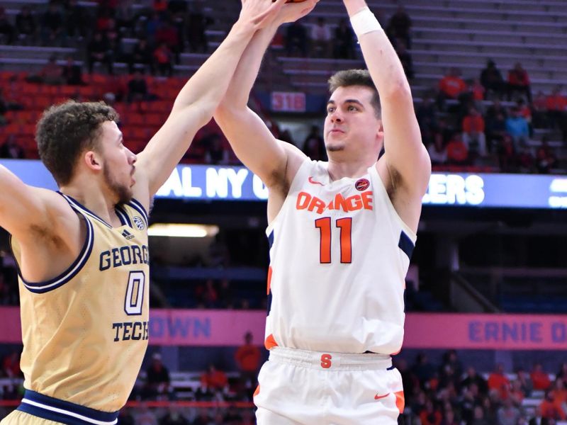 Feb 28, 2023; Syracuse, New York, USA; Syracuse Orange guard Joseph Girard III (11) takes a jump shot over the defense of Georgia Tech Yellow Jackets guard Lance Terry (0) in the second half at the JMA Wireless Dome. Mandatory Credit: Mark Konezny-USA TODAY Sports