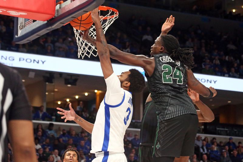 Feb 11, 2024; Memphis, Tennessee, USA; Tulane Green Wave forward Kevin Cross (24) blocks the shot of Memphis Tigers center Jordan Brown (3) during the first half at FedExForum. Mandatory Credit: Petre Thomas-USA TODAY Sports