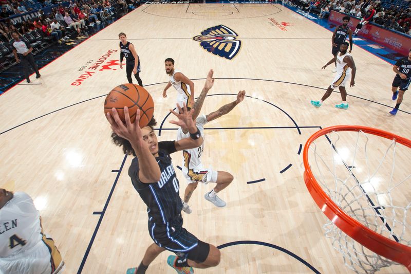 NEW ORLEANS, LA - OCTOBER 7:  Anthony Black #0 of the Orlando Magic drives to the basket during the game against the New Orleans Pelicans on October 7, 2024 at the Smoothie King Center in New Orleans, Louisiana. NOTE TO USER: User expressly acknowledges and agrees that, by downloading and or using this Photograph, user is consenting to the terms and conditions of the Getty Images License Agreement. Mandatory Copyright Notice: Copyright 2024 NBAE (Photo by Layne Murdoch Jr./NBAE via Getty Images)