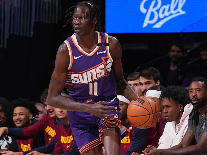 DENVER, CO - OCTOBER 13: Bol Bol #11 of the Phoenix Suns dribbles the ball during the game against the Denver Nuggets on October 13, 2024 at Ball Arena in Denver, Colorado. NOTE TO USER: User expressly acknowledges and agrees that, by downloading and/or using this Photograph, user is consenting to the terms and conditions of the Getty Images License Agreement. Mandatory Copyright Notice: Copyright 2024 NBAE (Photo by Bart Young/NBAE via Getty Images)