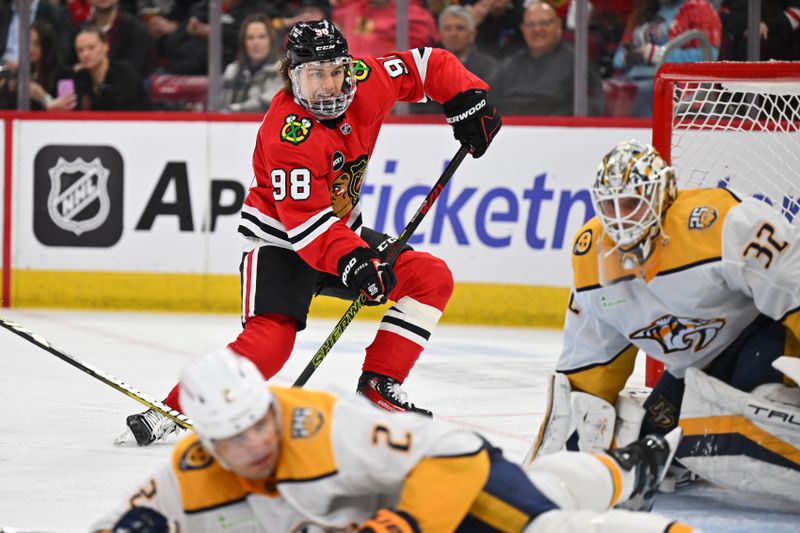 Apr 12, 2024; Chicago, Illinois, USA; Chicago Blackhawks forward Connor Bedard (98) skates by the net looking for the puck in the second period against the Nashville Predators at United Center. Mandatory Credit: Jamie Sabau-USA TODAY Sports