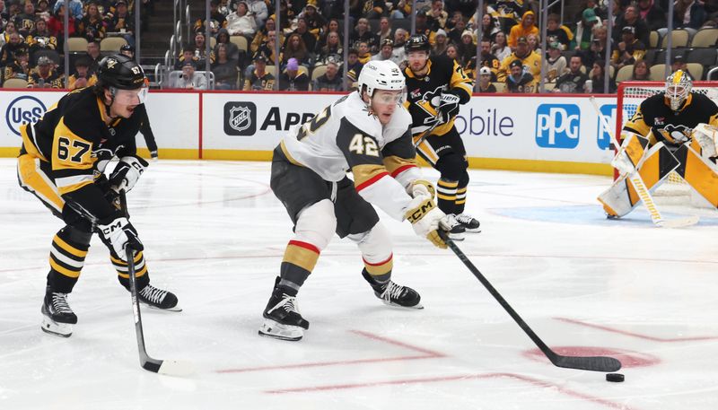 Mar 1, 2026; Pittsburgh, Pennsylvania, USA;  Vegas Golden Knights right wing Braeden Bowman (42) reaches for a loose puck ahead of Pittsburgh Penguins right wing Rickard Rakell (67) during the second period at PPG Paints Arena. Mandatory Credit: Charles LeClaire-Imagn Images