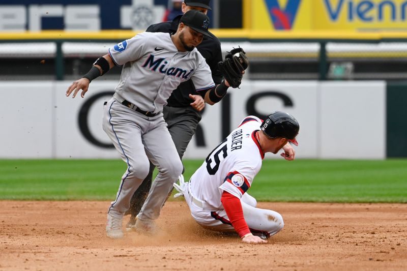 Jun 11, 2023; Chicago, Illinois, USA; Chicago White Sox right fielder Clint Frazier (15) steals second base under  Miami Marlins second baseman Luis Arraez (3) at Guaranteed Rate Field. Mandatory Credit: Matt Marton-USA TODAY Sports