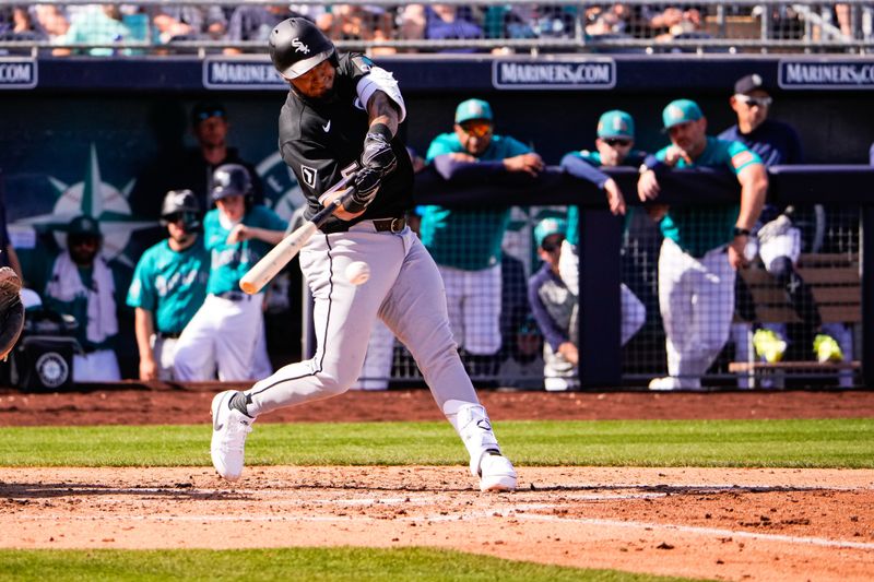Feb 24, 2026; Peoria, Arizona, USA; Chicago White Sox third baseman Munetaka Murakami (5) hits against the Seattle Mariners during the third inning in Peoria, Arizona. Mandatory Credit: Arianna Grainey-Imagn Images