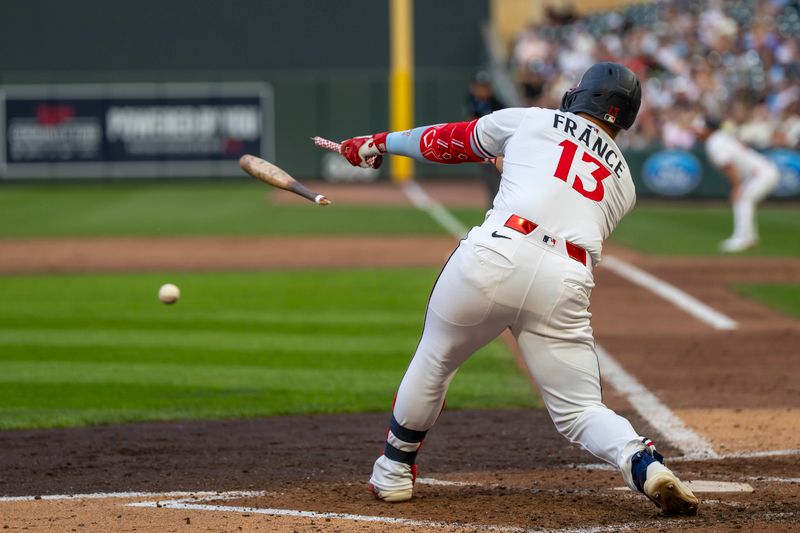 Jun 24, 2025; Minneapolis, Minnesota, USA; Minnesota Twins first baseman Ty France (13) bat breaks during an at bat against the Seattle Mariners in the fourth inning at Target Field. Mandatory Credit: Jesse Johnson-Imagn Images