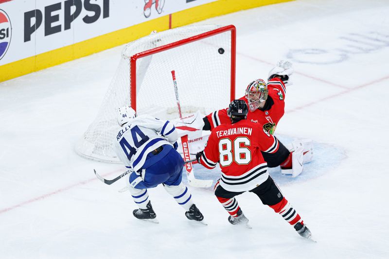 Nov 15, 2025; Chicago, Illinois, USA; Toronto Maple Leafs defenseman Morgan Rielly (44) scores against the Chicago Blackhawks during the second period at United Center. Mandatory Credit: Kamil Krzaczynski-Imagn Images
