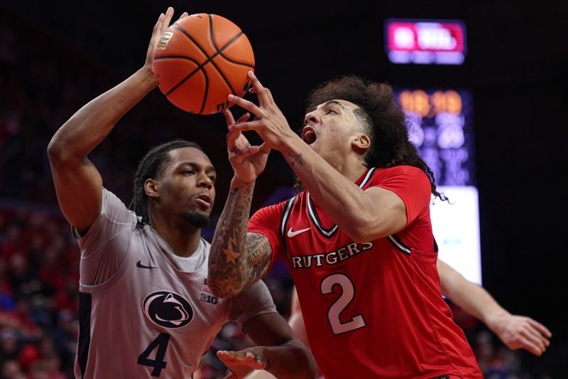 Mar 8, 2026; Piscataway, New Jersey, USA; Rutgers Scarlet Knights guard Lino Mark (2) goes to the basket during the first half against Rutgers Scarlet Knights forward Bryce Dortch (4) at Jersey Mike's Arena. Mandatory Credit: Vincent Carchietta-Imagn Images