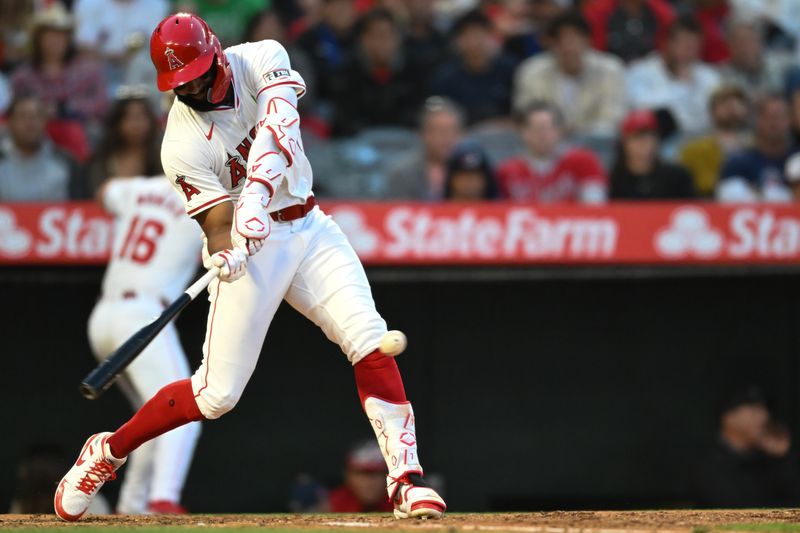 May 25, 2024; Anaheim, California, USA; Los Angeles Angels outfielder Jo Adell (7) singles against the Cleveland Guardians during the fourth inning at Angel Stadium. Mandatory Credit: Jonathan Hui-USA TODAY Sports