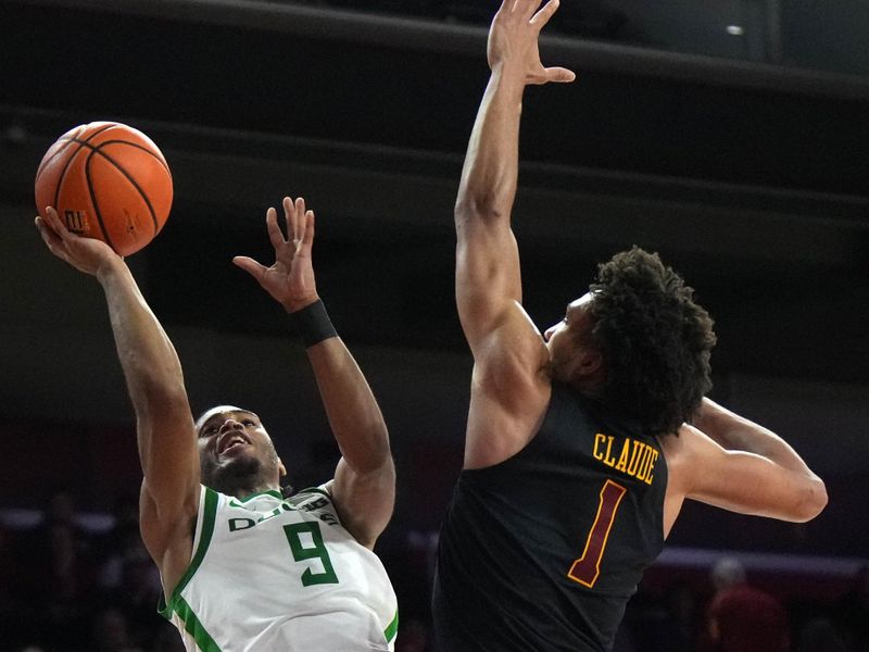 Dec 4, 2024; Los Angeles, California, USA;Oregon Ducks guard Keeshawn Barthelemy (9) shoots the ball against Southern California Trojans guard Desmond Claude (1) in the second half at Galen Center. Mandatory Credit: Kirby Lee-Imagn ImagesDec 4, 2024; Los Angeles, California, USA; at Galen Center. Mandatory Credit: Kirby Lee-Imagn Images