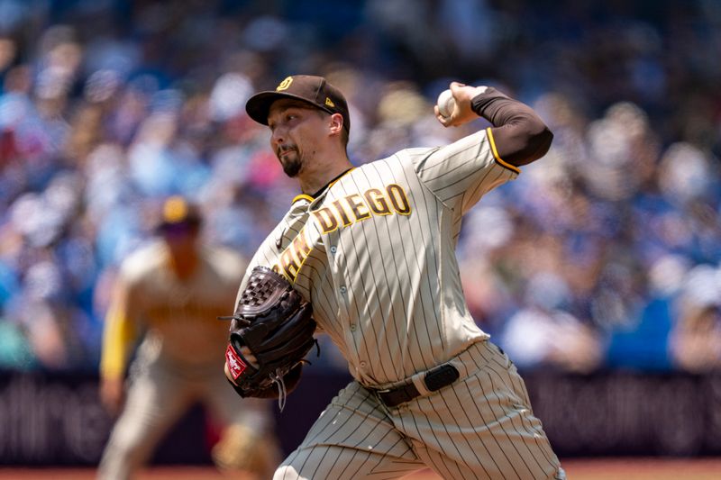 Jul 20, 2023; Toronto, Ontario, CAN; San Diego Padres starting pitcher Blake Snell (4) pitches to the Toronto Blue Jays during the second inning at Rogers Centre. Mandatory Credit: Kevin Sousa-USA TODAY Sports