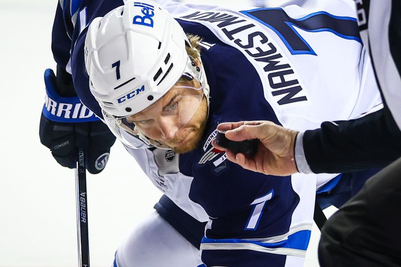 Oct 26, 2024; Calgary, Alberta, CAN; Winnipeg Jets center Vladislav Namestnikov (7) during the face off against the Calgary Flames during the first period at Scotiabank Saddledome. Mandatory Credit: Sergei Belski-Imagn Images